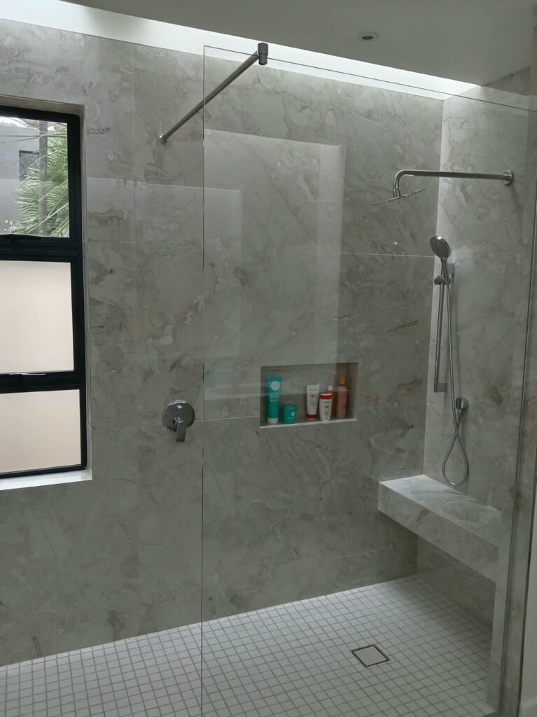 Tiled shower and recessed shelf