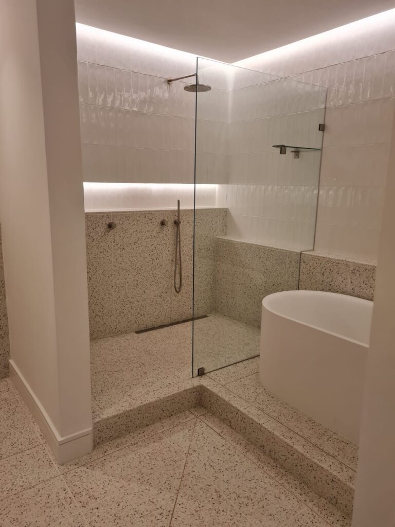 Bathroom renovation — shower, bath and tiled finishes